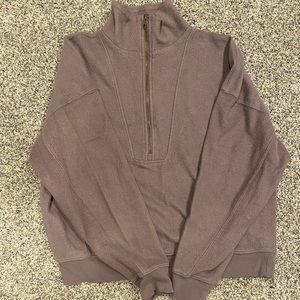 Universal Threat cropped half zip pullover.